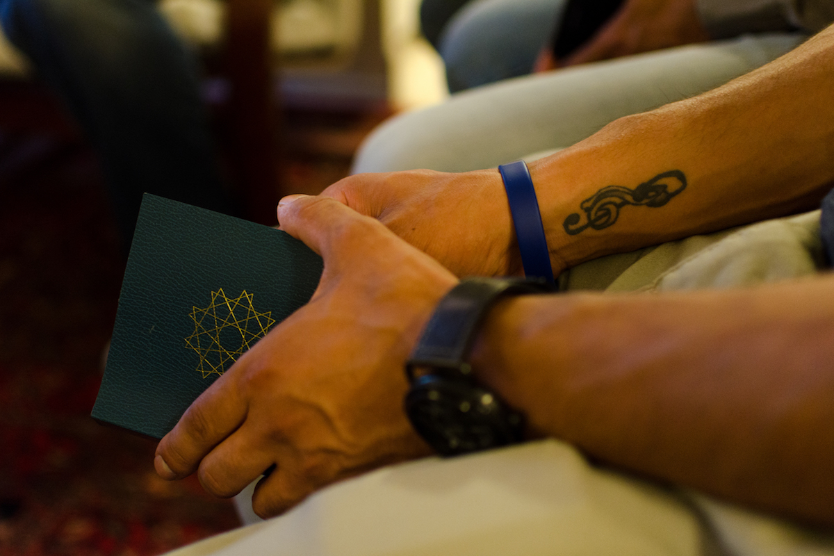 Hands holding a prayer book